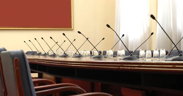 Conference room with microphones — Stock Photo, Image