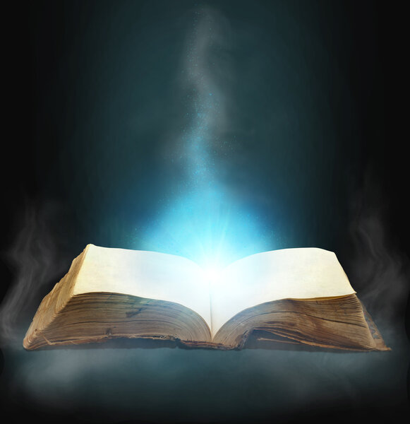 Opened magic book with magic light for you design