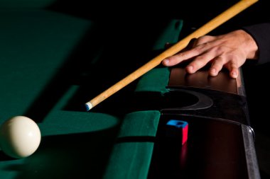 Playing billiards with balls on a green felt table clipart