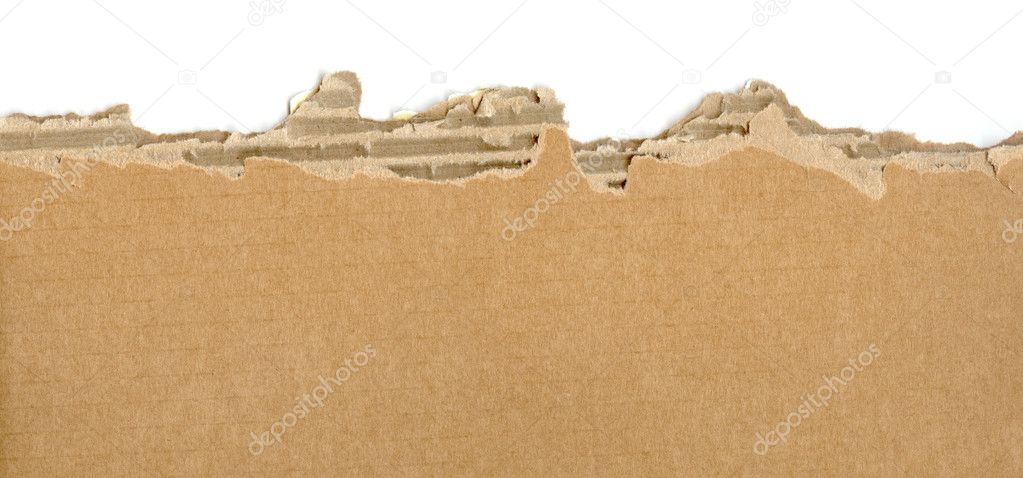 A piece of cardboard ripped in a close up picture.