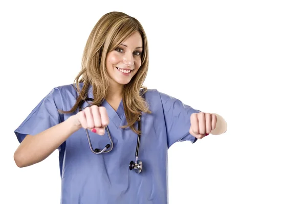 Enfermera sosteniendo signo u objeto en blanco — Foto de Stock