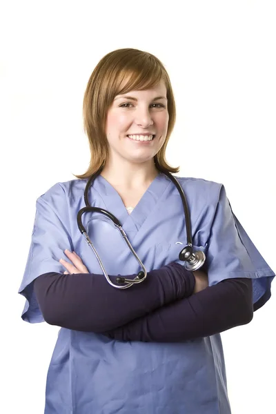 Enfermeira de braços cruzados sorrindo — Fotografia de Stock