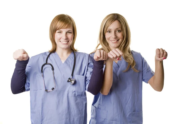 Enfermeras sosteniendo cartel en blanco —  Fotos de Stock