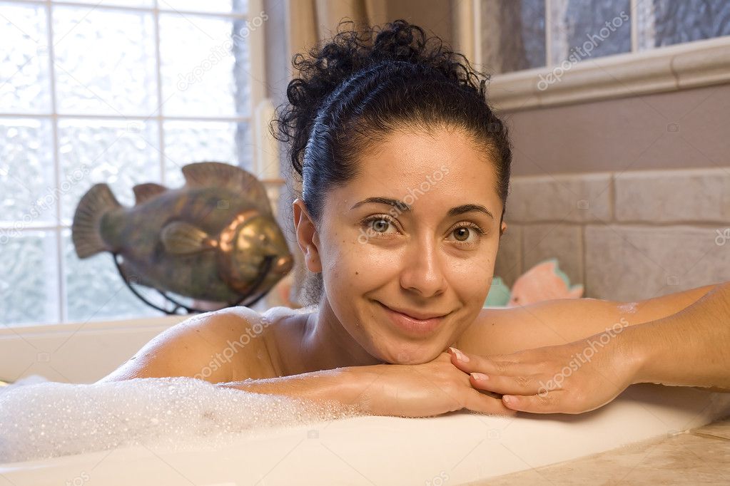 Woman taking bubble bath