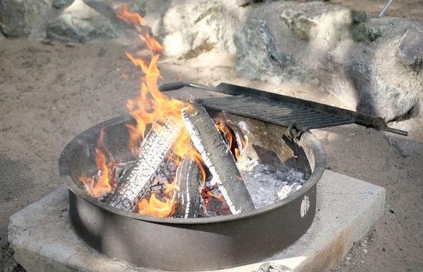 stock image Campfire burning in a metal pit