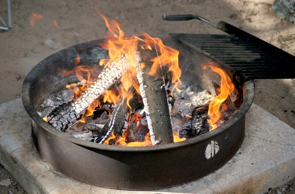 Stock image Campfire burning in a metal pit