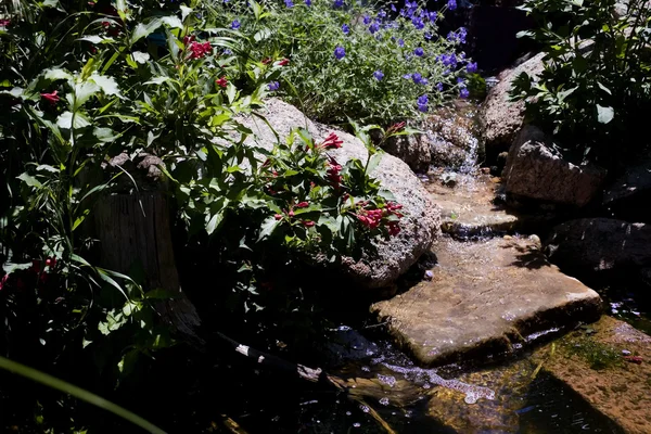 Flowing stream of a water feature