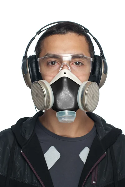 Mladý muž nosí brýle, respirátor a ochrana sluchu Stock Obrázky