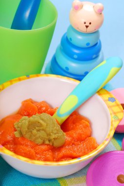 Carrot and green peas puree for baby clipart