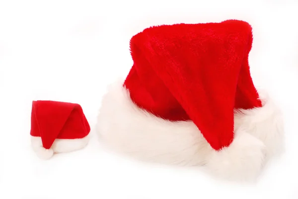Grote en kleine santa hoeden — Stockfoto