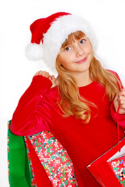 Santa ajándék táska ruhával fiatal lány — Stock Fotó