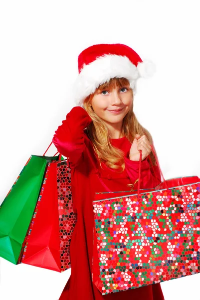 Young girl in santa cloth with gift bags — Stock Photo, Image