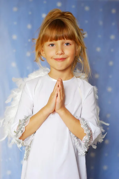 Angel girl with hands folded to the prayer — Stock Photo, Image
