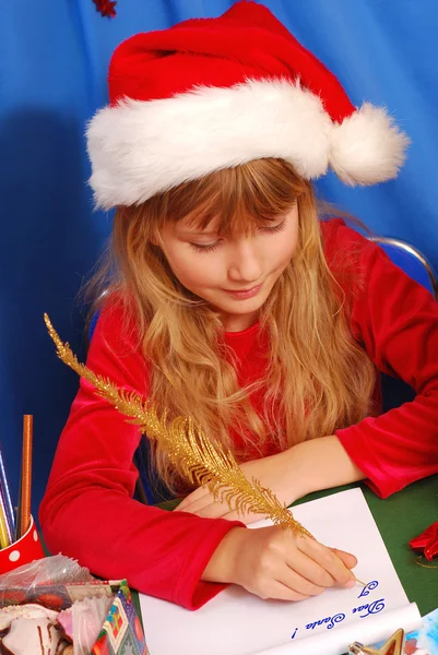 Girl writing a letter to santa — Stock Photo, Image