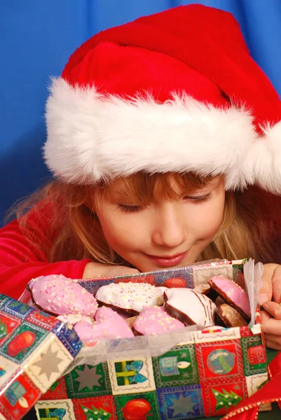 Girl and christmas gingerbreads — Stock Photo, Image