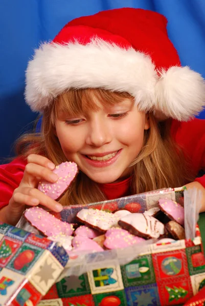 Girl and christmas gingerbreads — Stock Photo, Image