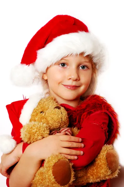 Petite fille en tissu de Père Noël avec ours en peluche — Photo