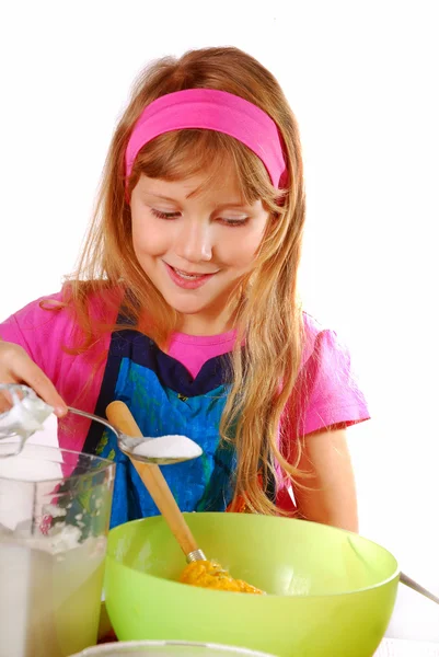 Young girl helping in baking cake — Stock Photo, Image