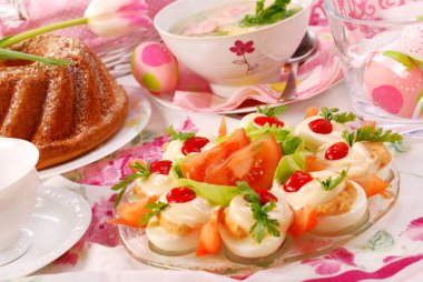 Traditional dishes for polish easter breakfast on festive table clipart