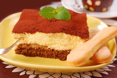 Piece of traditional tiramisu cake with lady fingers cookies clipart