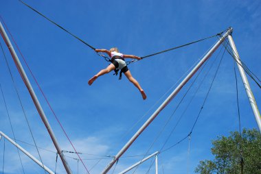 Young girl having fun on rope jumping clipart