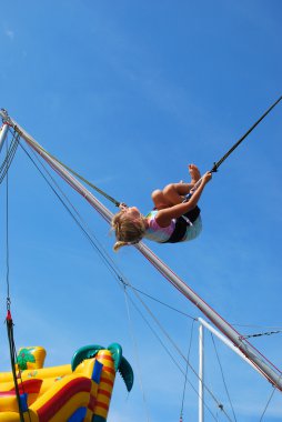 Young girl on rope jumping clipart