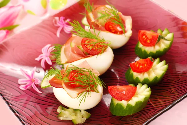 Eggs with parma ham for easter — Stock Photo, Image