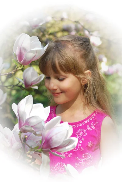 Young girl in spring garden in high key — Stock Photo, Image