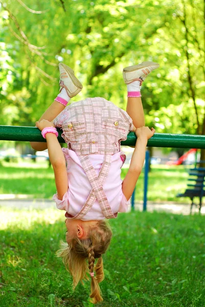 Young girl doing somersault — Stock Photo, Image