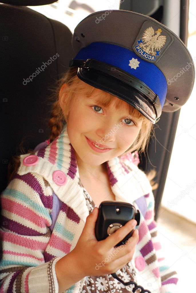 Young girl in police hat