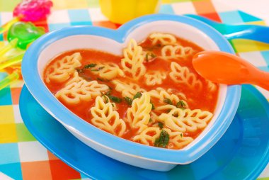 Tomato soup with pasta for child clipart