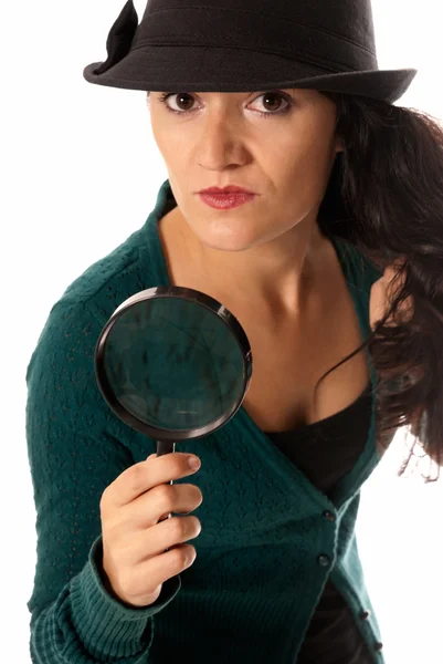 Young woman with magnifier glass and hat looking to camera isolated on whit — Stock Photo, Image