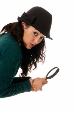 Young woman with magnifier glass and hat looking to camera isolated on whit clipart