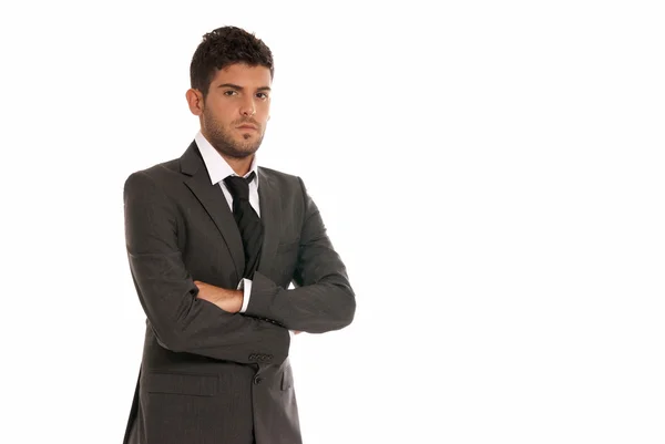 Young businessman with copy-space looking serious arms crossed isolated on — Stock Photo, Image