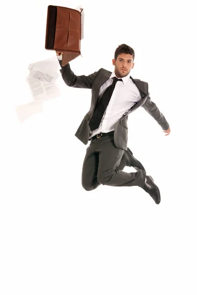 Young businessman jumping with open briefcase falling papers copy-space iso — Stock Photo, Image