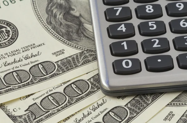 Calculator on US dollars background — Stock Photo, Image