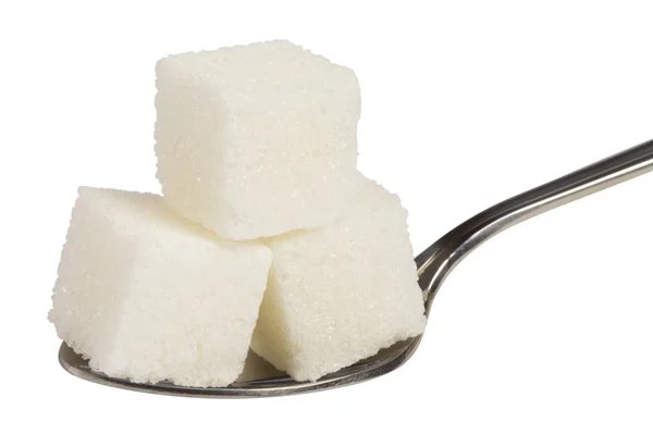 Cubo de açúcar branco na colher — Fotografia de Stock