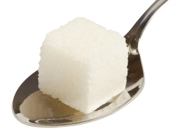 Kubus gula putih pada sendok — Stok Foto