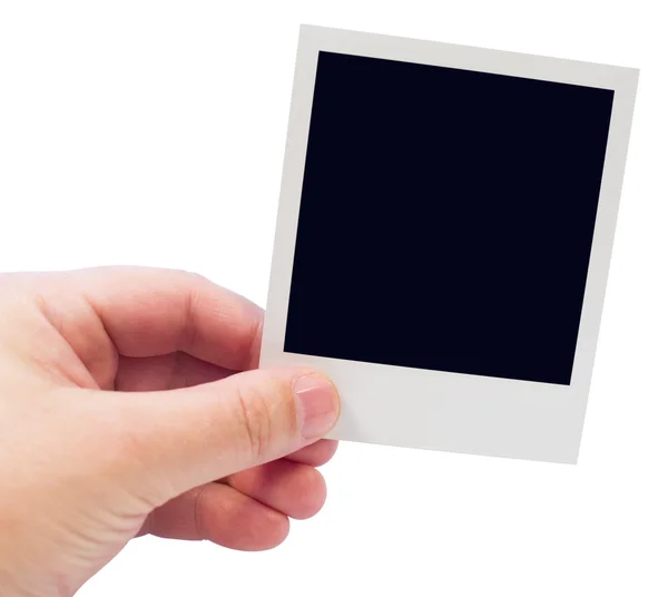 Jeden polaroid w ręku — Zdjęcie stockowe