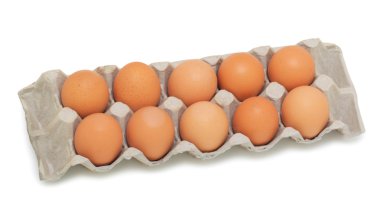 Fresh brown eggs in box, isolated on a white background clipart