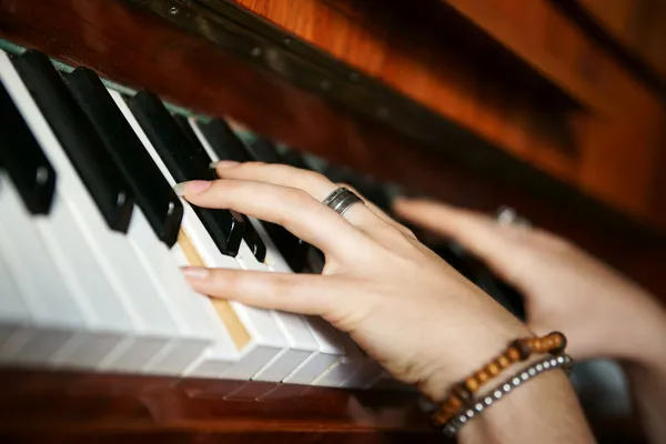 Hands playing music on the piano, hands and piano player, keyboa