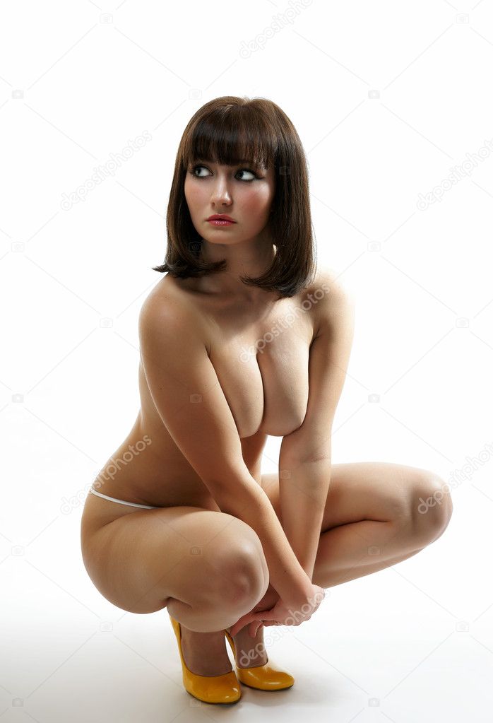 The undressed girl on a white background