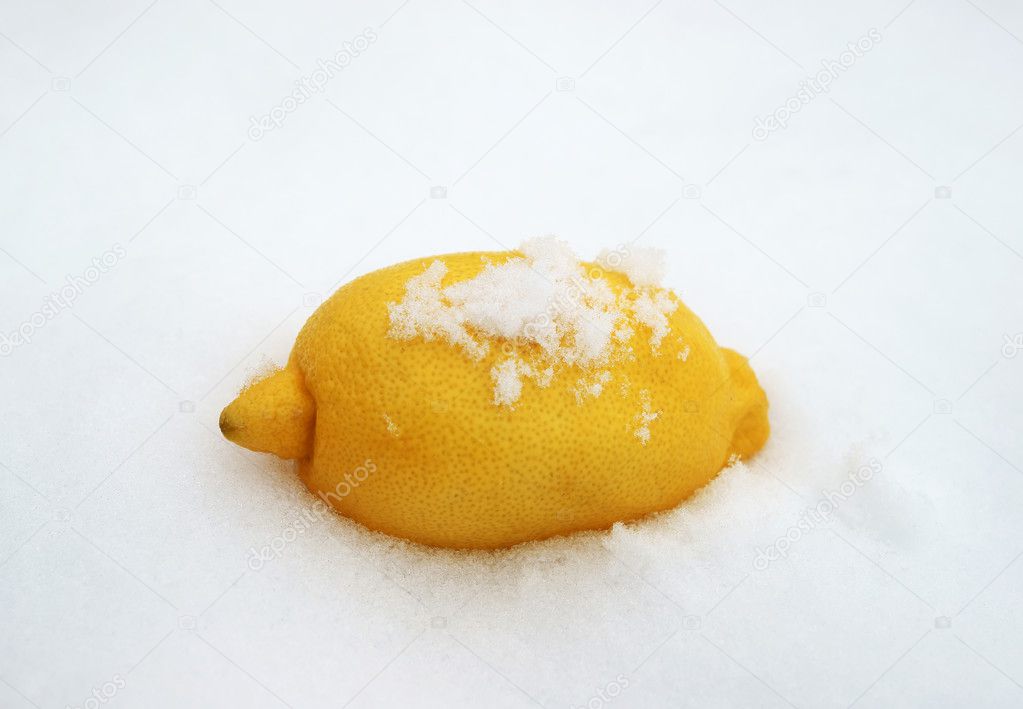 Ripe lemon on snow