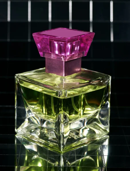 Bottle of perfume with reflexion — Stock Photo, Image