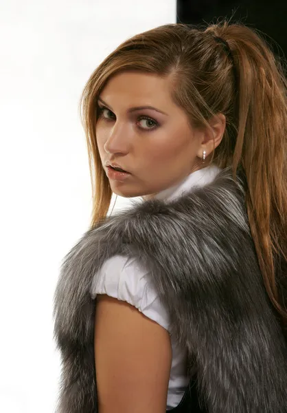 Portrait of the girl in a fur sleeveless jacket — Stock Photo, Image