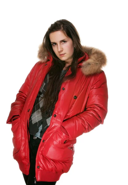 Flickan i en röd jacka på en vit bakgrund — Stockfoto