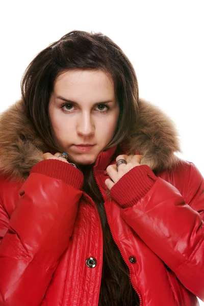 A menina em uma jaqueta vermelha em um fundo branco — Fotografia de Stock