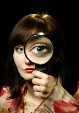 The girl with a magnifier clipart