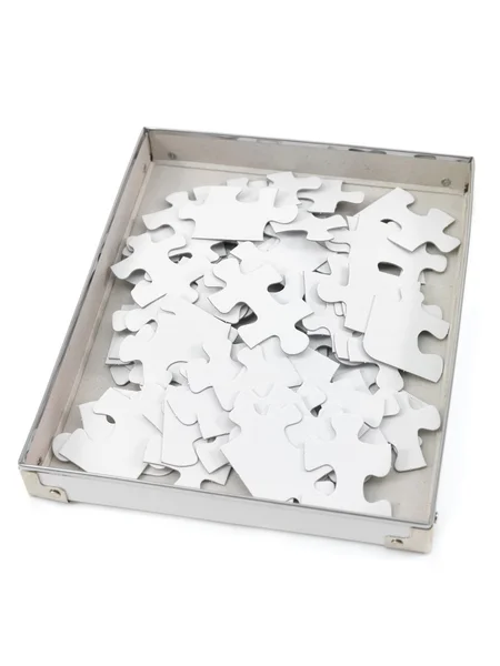 白い背景に対して隔離されるジグソー パズルのピース — ストック写真