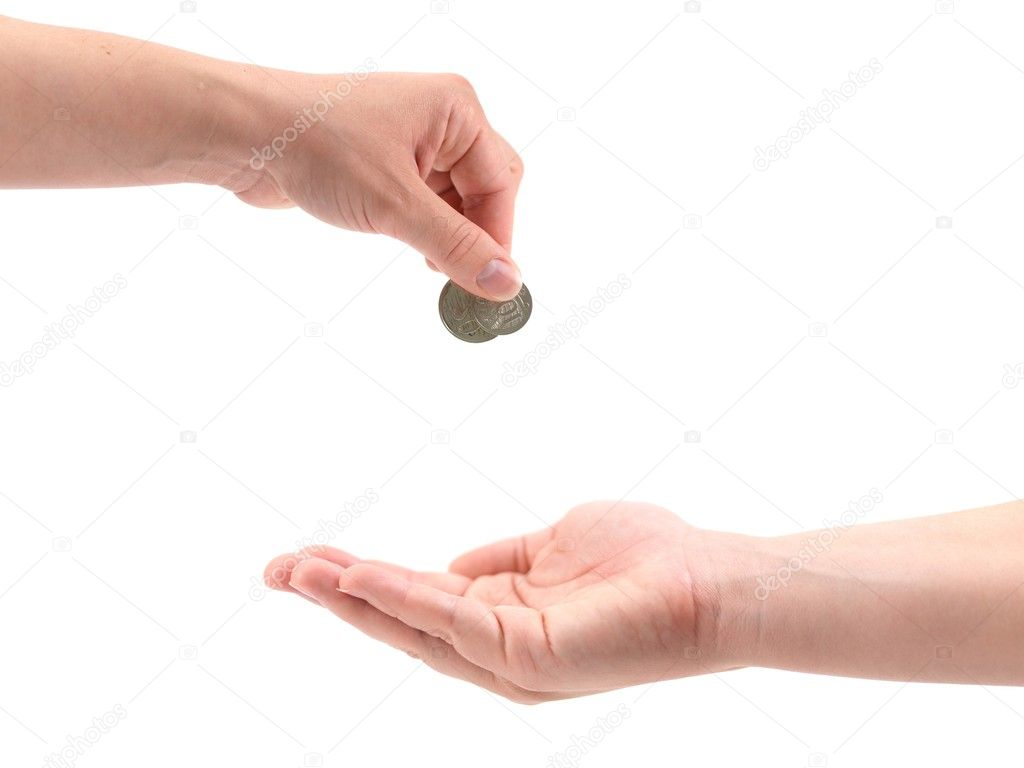 A female hand with coin isolated against a white background